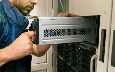 An engineer installing a ups generator system.